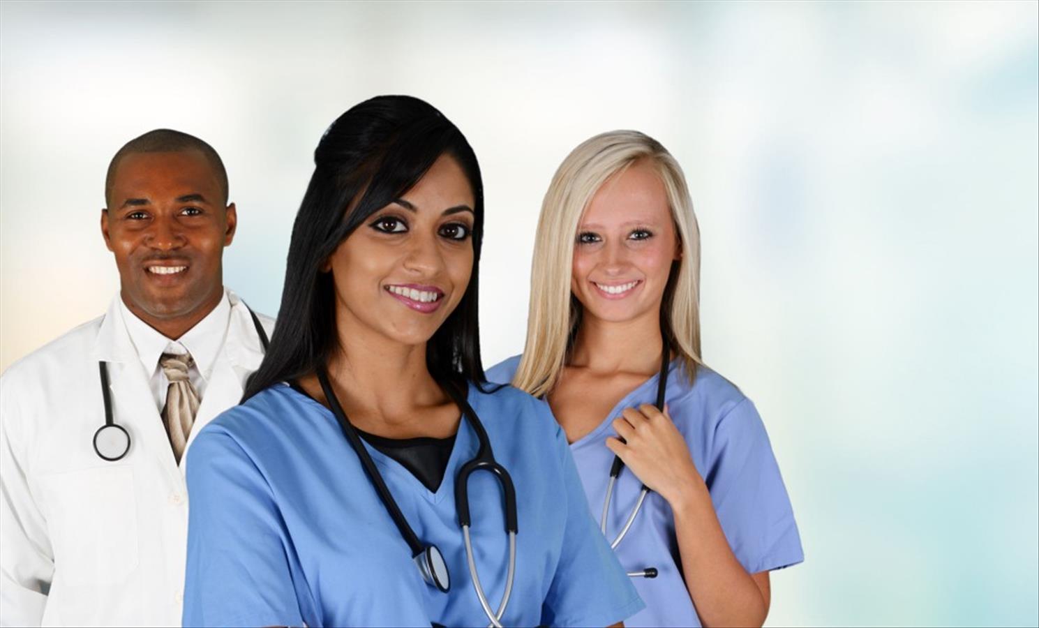 Medical professionals smiling with stethoscopes.